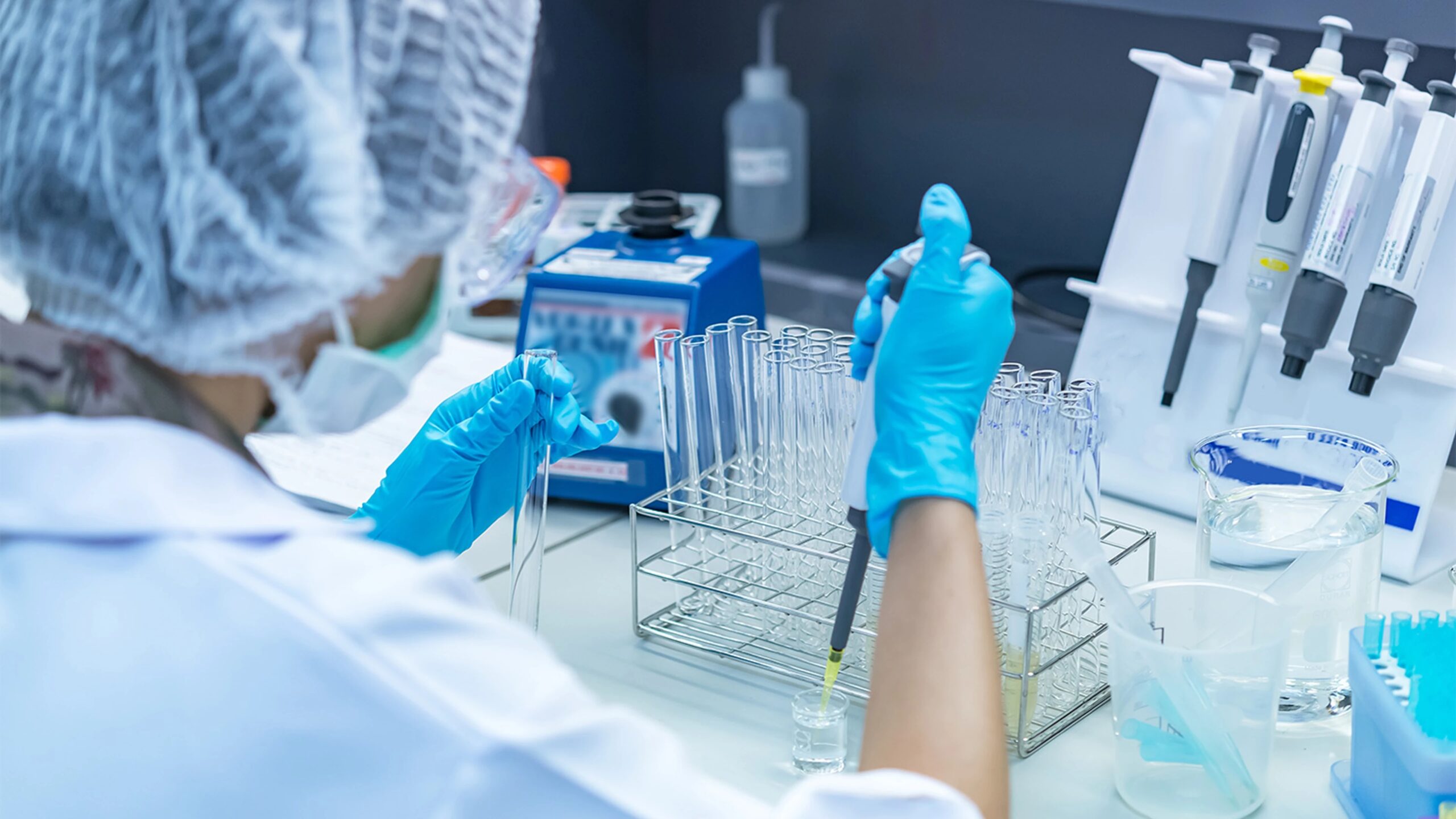 Scientists in a mobile biocontainment lab during deployment